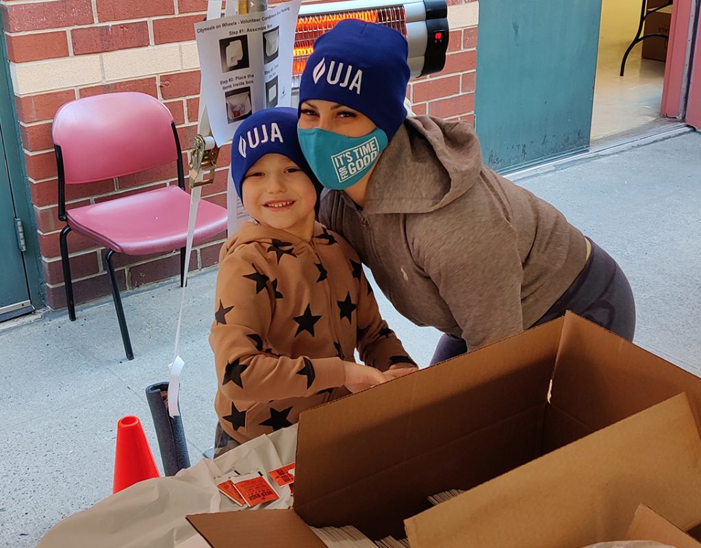 woman taking picture with little kid at YM&うん