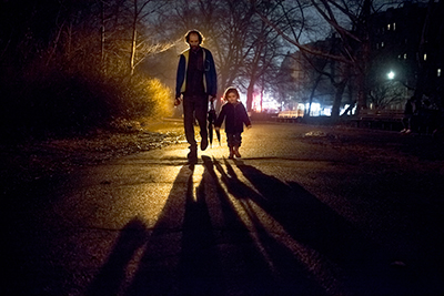 kid holding dad hand in foggy night at YM&YWHA