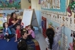 young kids sitting in class room YNS at YM&JAH